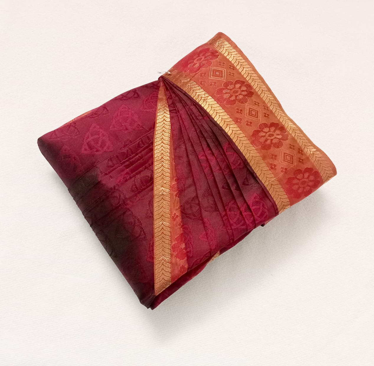 Saree neatly folded and packed, ready for delivery.