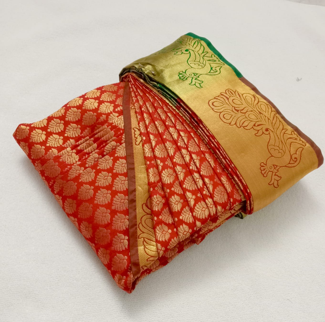 Gallery 1: Woman standing gracefully in a silk saree.