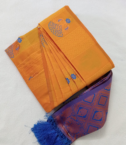 Close up of a traditional red and gold bridal silk saree.